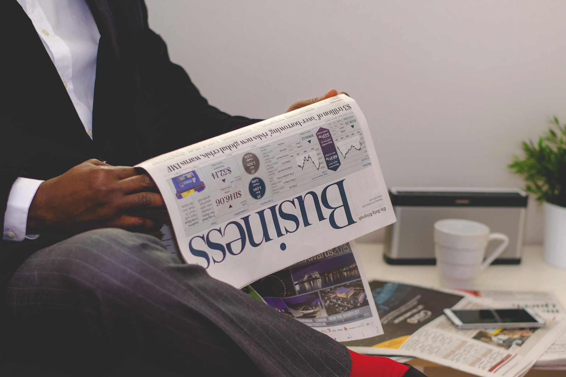 Man reading a business newspaper